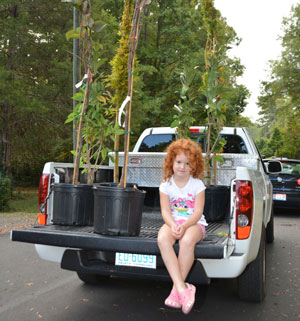 girl-and-trees-truck-bed